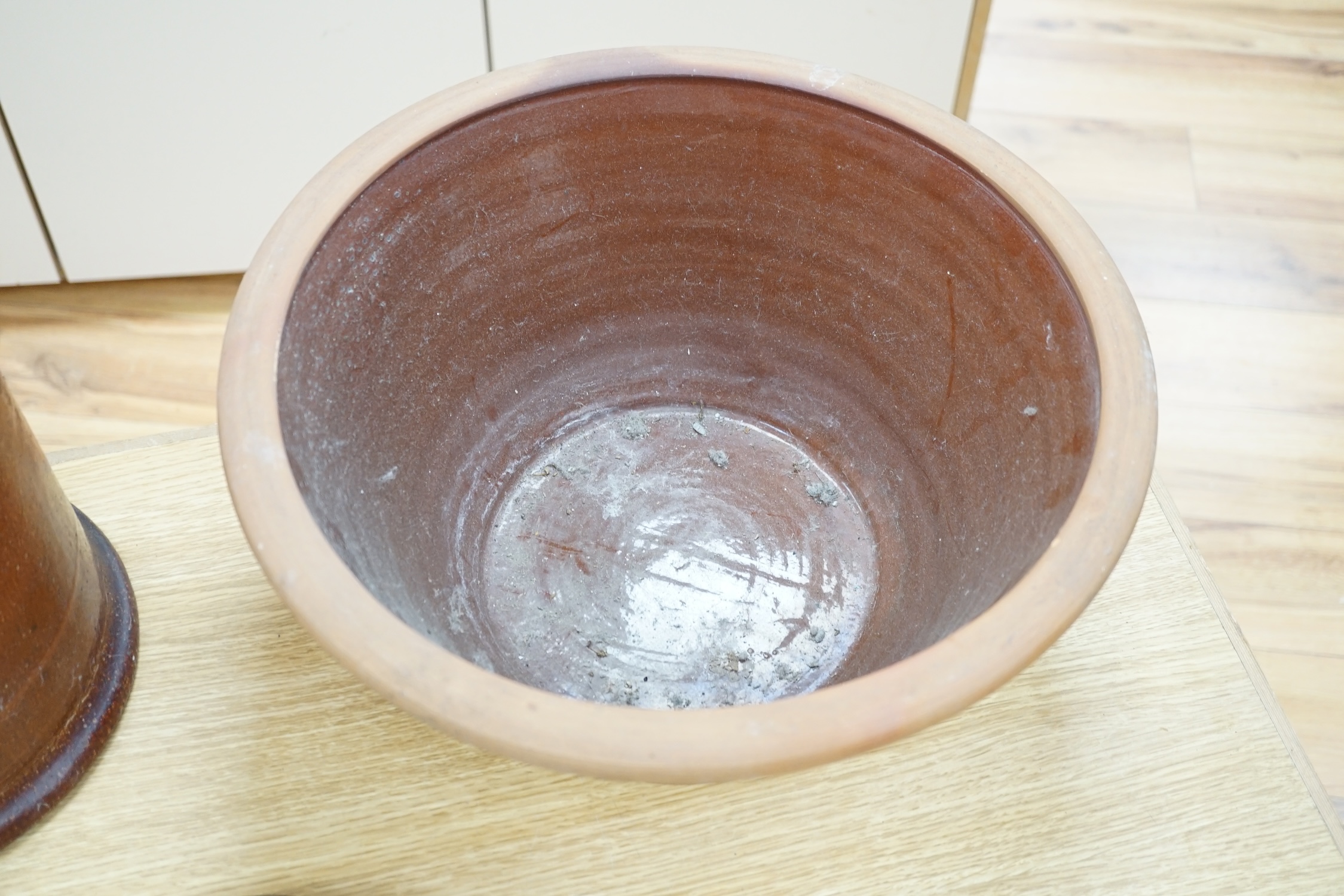 A late Victorian salt glazed bird feeder, and a dairy bowl, feeder 39cm high. Condition - both have chips